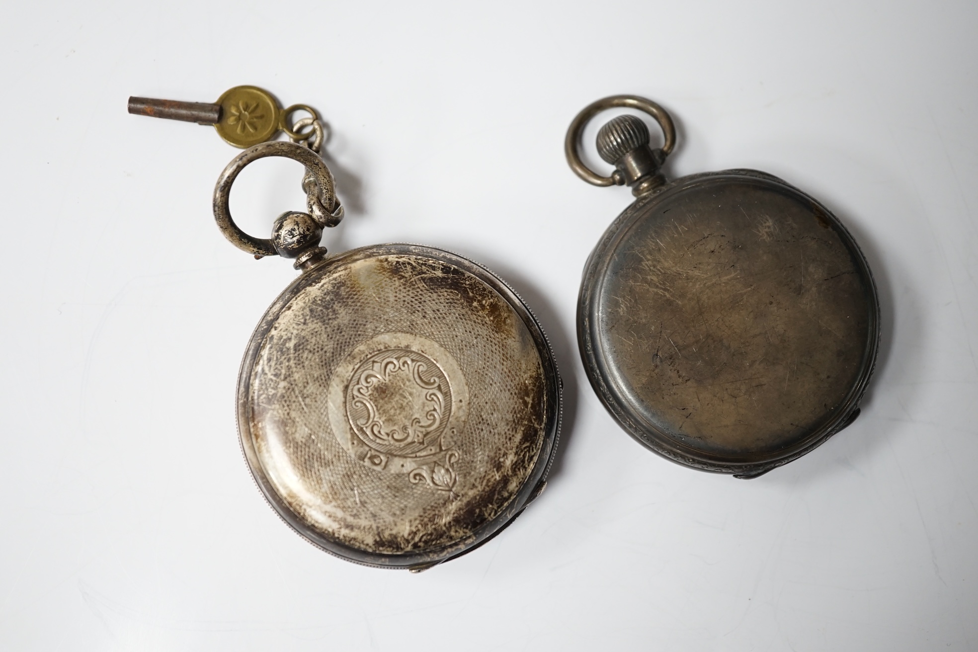 A Victorian silver open face keywind pocket watch by Davies of Ebbe Vale and one other late silver pocket watch. Condition - poor